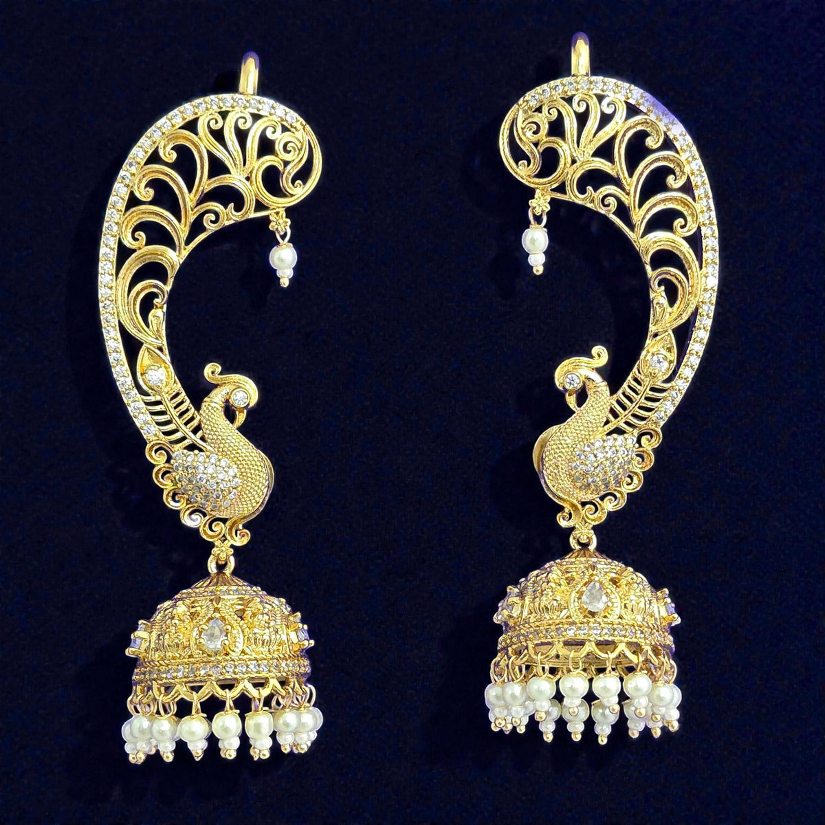 Peacock ear cuff jhumka earrings in gold polished and american diamonds