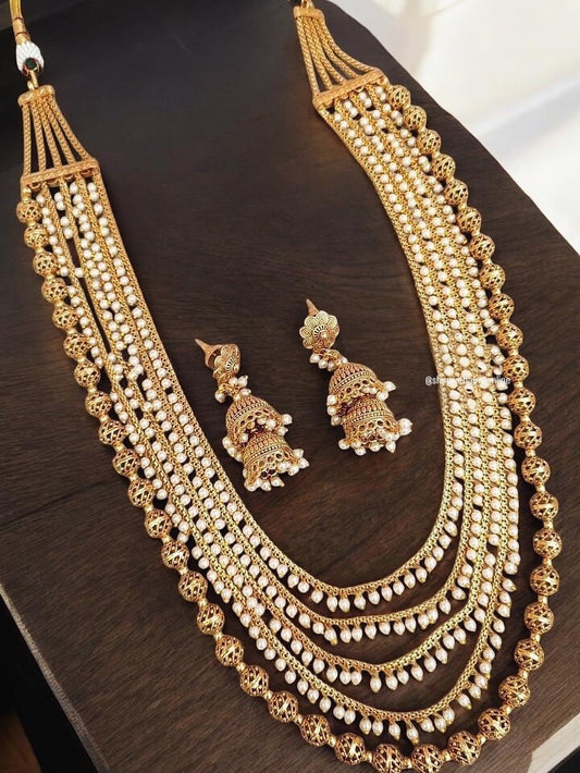 Layered long necklace with pearls and gold polished beads antique finish with jhumkas