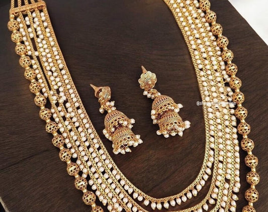 Layered long necklace with pearls and gold polished beads antique finish with jhumkas