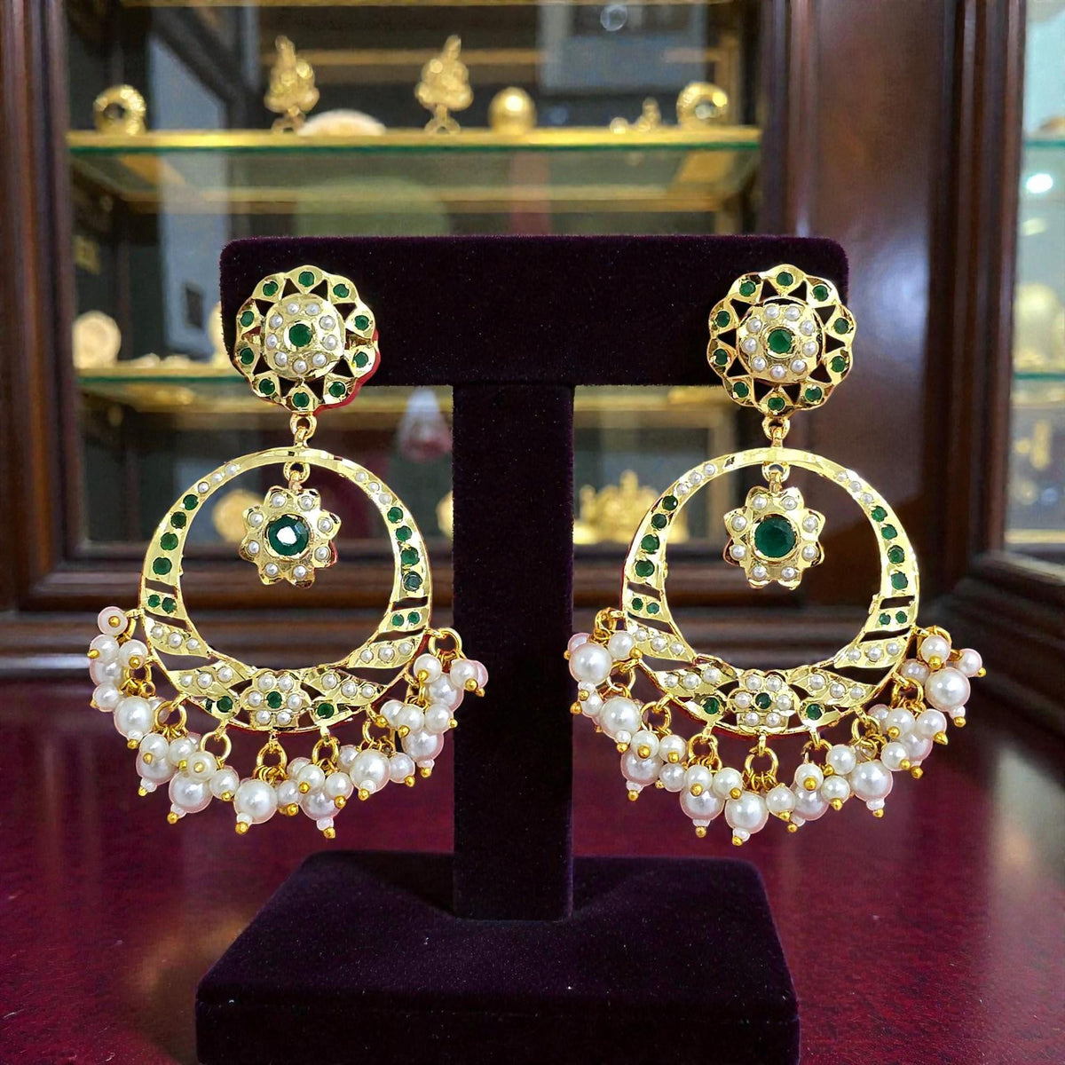 Green diamonds AD, Jadau and pearl jhumkas gold polished chandelier earrings trendy lightweight