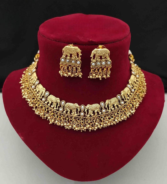 Short traditional gold necklace set with elephant design and pearls