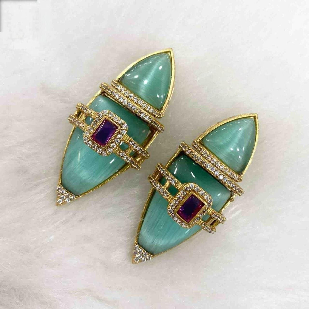 Semiprecious stones boat shaped earrings with american diamonds gold polished