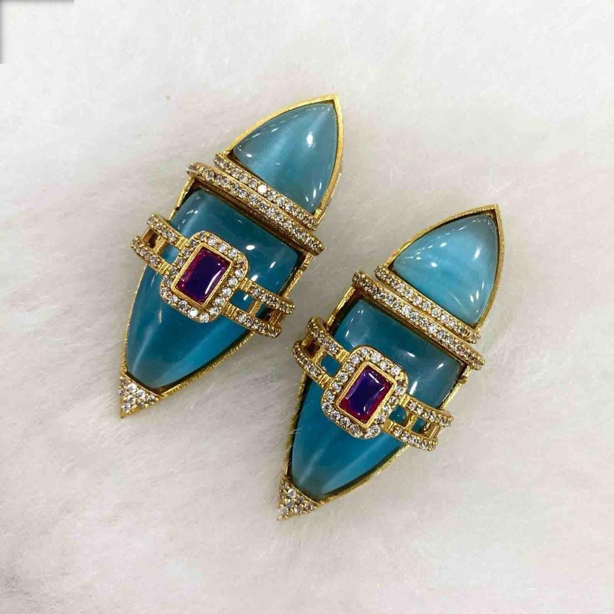 Semiprecious stones boat shaped earrings with american diamonds gold polished