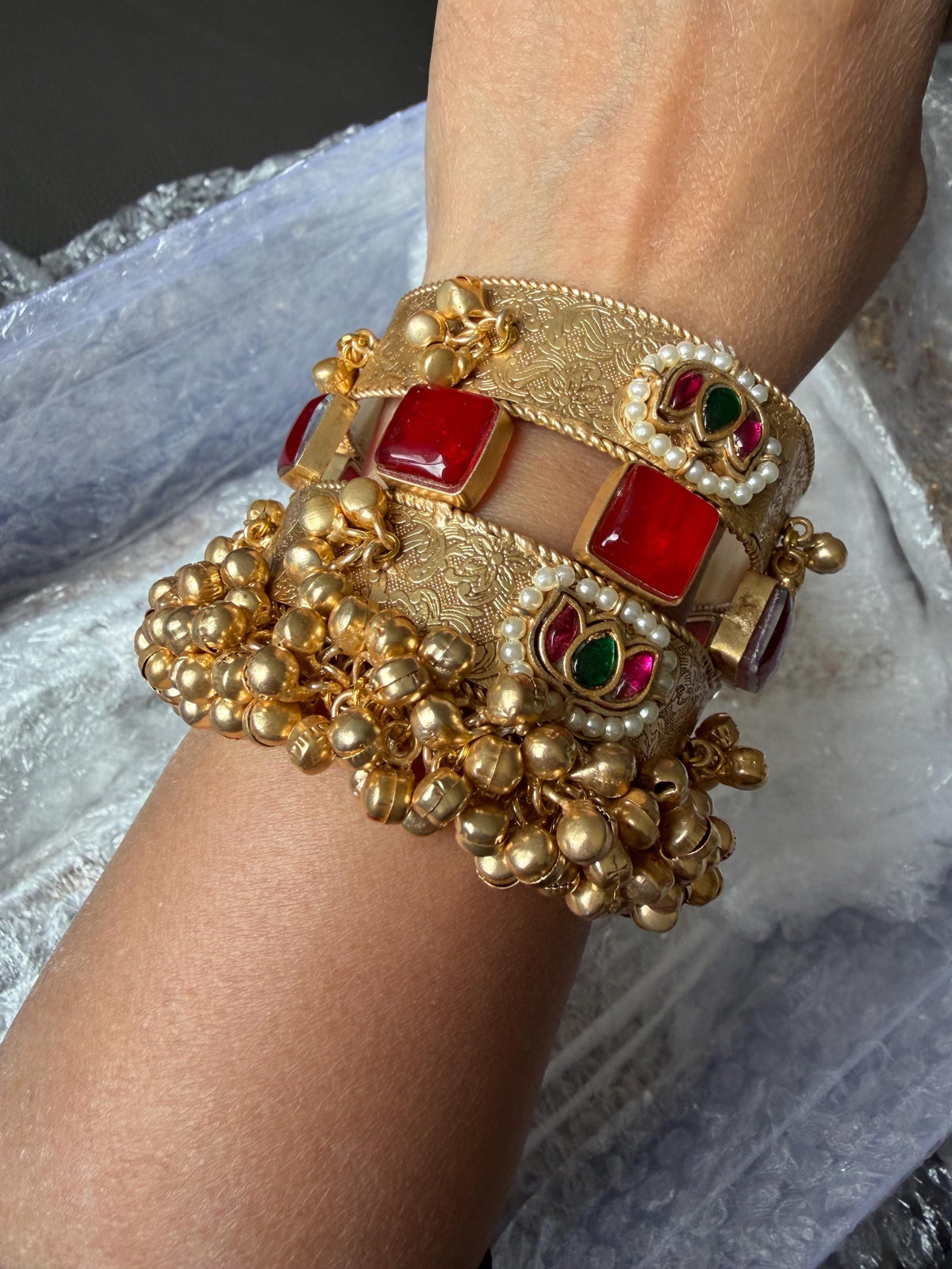 Handcrafted gold polished kada with semiprecious stones and Jadau