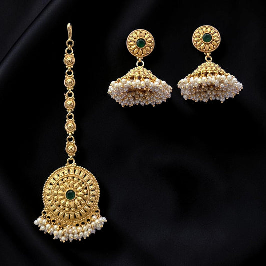 Small golden and pearl jhumkis with gold polished earrings with maang tikka