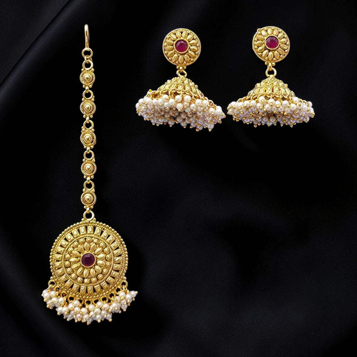 Small golden and pearl jhumkis with gold polished earrings with maang tikka