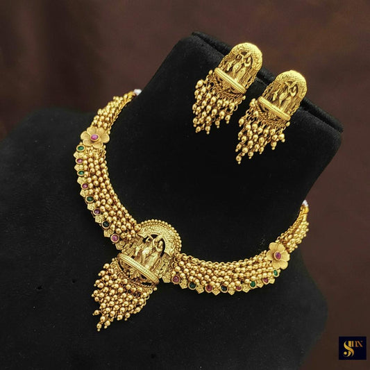 Gold temple design necklace set ruby green
